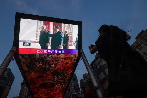 epa12956903 A screen shows Chinese President Xi Jinping and US President Donald Trump visiting the Temple of Heaven in Beijing, China, 14 May 2026. US President Trump is in Beijing for a high-stakes state visit running through 15 May, marking his first return to the mainland since 2017.  EPA/WU HAO