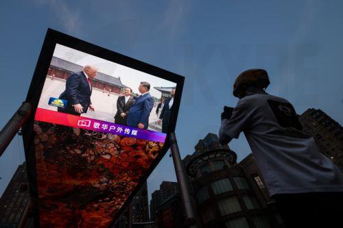 epa12956905 A screen shows Chinese President Xi Jinping and US President Donald Trump visiting the Temple of Heaven in Beijing, China, 14 May 2026. US President Trump is in Beijing for a high-stakes state visit running through 15 May, marking his first return to the mainland since 2017.  EPA/WU HAO
