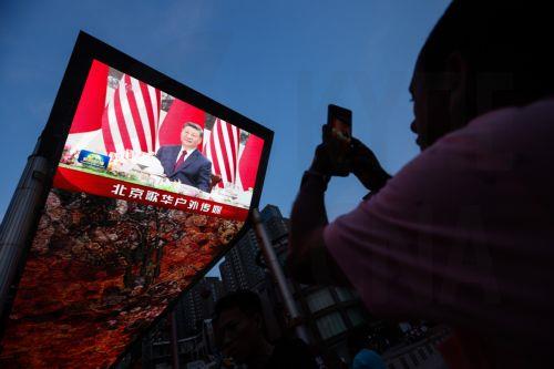 epa12956907 A screen shows Chinese President Xi Jinping attending a welcoming banquet at the Great Hall of the People in Beijing, China, 14 May 2026. US President Trump is in Beijing for a high-stakes state visit running through 15 May, marking his first return to the mainland since 2017.  EPA/WU HAO