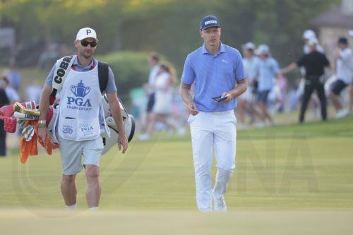 epa12969701 Matti Schmid of Germany and his caddie walk onto the 18th green during the 2026 PGA Championship at Aronimink Golf Club in Newtown Square, Pennsylvania, USA, 17 May 2026.  EPA/STEVE FALK