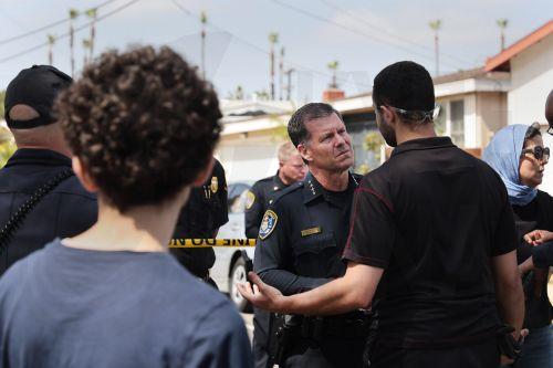 epa12972641 San Diego Police Chief Scott Wahl (C) listens to a member of the muslim community after an active shooting incident at the Islamic Center of San Diego, in San Diego, California, USA, 18 May 2026.  Police agencies from across San Diego County responded to an active shooter incident at the Islamic Center of San Diego in the Clairemont...