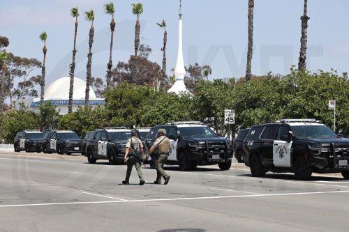 epa12972643 Law enforcement personnel gather on the scene to respond to an active shooting incident at the Islamic Center of San Diego, located in the Clairemont neighborhood in San Diego, California, USA, 18 May 2026.  Police agencies from across San Diego County responded to an active shooter incident at the Islamic Center of San Diego in the Clairemont...