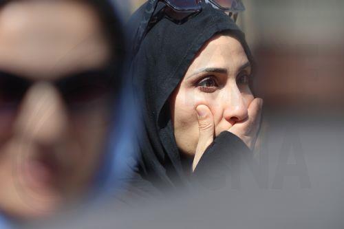 epa12972644 Rema Abedkader of San Diego reacts hours after the mosque shooting in San Diego, California, USA, 18 May 2026.  Police agencies from across San Diego County responded to an active shooter incident at the Islamic Center of San Diego in the Clairemont neighborhood. Three people were killed, including a security guard.  EPA/JOHN GASTALDO