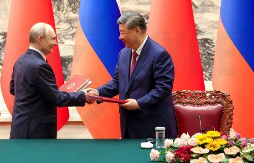 epa12977162 Russian President Vladimir Putin (L) and Chinese President Xi Jinping attend a signing ceremony at the Great Hall of the People in Beijing, China, 20 May 2026.  EPA/ALEXANDER KAZAKOV/KREMLIN / POOL MANDATORY CREDIT