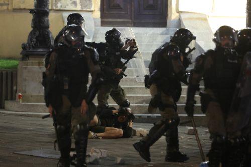 epa12988419 Riot police officers detain a protester after a mass student-led anti-government rally in Belgrade, Serbia, 23 May 2026. Thousands gathered to ramp up pressure on the government and demand early parliamentary elections. The political movement originally erupted across the country following the November 2024 canopy collapse at the Novi Sad...