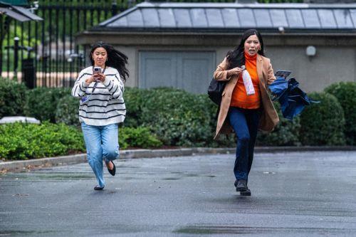 epa12989345 Reportes take cover following reports of gunfire near the White House complex in Washington, DC, USA, 23 May 2026. A suspect armed with a handgun approached a security checkpoint at 17th Street and Pennsylvania Avenue NW and opened fire, prompting U.S. Secret Service agents to return fire. The suspect was transported to a local hospital where he...
