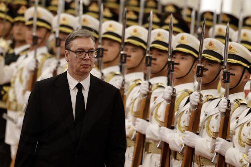 epa12992711 Serbian President Aleksandar Vucic reviews the honor guard during a welcoming ceremony hosted by the Chinese president and his wife at the Great Hall of the People in Beijing, China, 25 May 2026.  EPA/TINGSHU WANG / POOL