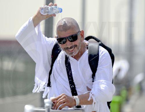 epa12992728 A Muslim pilgrim refresh himself at one of the water fountains on his way to the Mina tent camp on Yawm al-Tarwiyah (the Day of Watering) for the start of the Hajj 2026 pilgrimage in Mecca, Saudi Arabia, 25 May 2026. According to Saudi authorities, more than 1.5 million pilgrims from abroad had arrived in the country to perform Hajj in 2026. ...