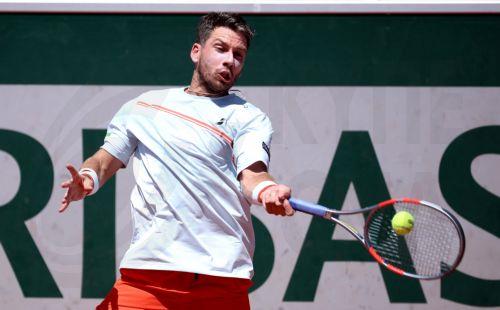 epa12994980 Cameron Norrie of Great Britain hits a forehand during his Men's 1st round match against Adolfo Daniel Vallejo of Paraguay at the French Open Grand Slam tennis tournament at Roland Garros in Paris, France, 26 May 2026.  EPA/CHRISTOPHE PETIT TESSON