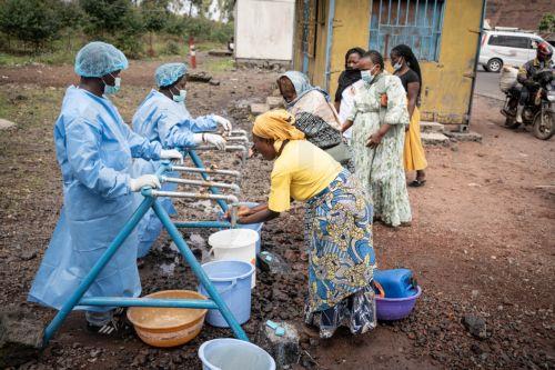 epa12997443 Locals wash their hands at a checkpoint set up for preventive measures against the spread of Ebola in Kanyaruchinya, near Goma, North Kivu, Democratic Republic of Congo, 27 May 2026. The World Health Organization (WHO) has declared the Ebola outbreak, caused by the Bundibugyo virus, in the Democratic Republic of the Congo a public health...