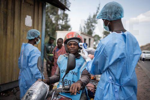 epaselect epa12997409 Health workers in protective gowns and masks check locals’ temperature as a preventive measure against Ebola in Kanyaruchinya, near Goma, North Kivu, Democratic Republic of Congo, 27 May 2026. The World Health Organization (WHO) has declared the Ebola outbreak, caused by the Bundibugyo virus, in the Democratic Republic of the Congo a...