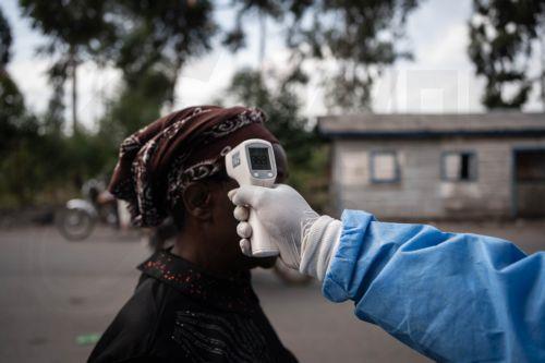 epaselect epa12997411 A health worker in a protective gown and mask checks locals’ temperature as a preventive measure against Ebola in Kanyaruchinya, near Goma, North Kivu, Democratic Republic of Congo, 27 May 2026. The World Health Organization (WHO) has declared the Ebola outbreak, caused by the Bundibugyo virus, in the Democratic Republic of the Congo a...