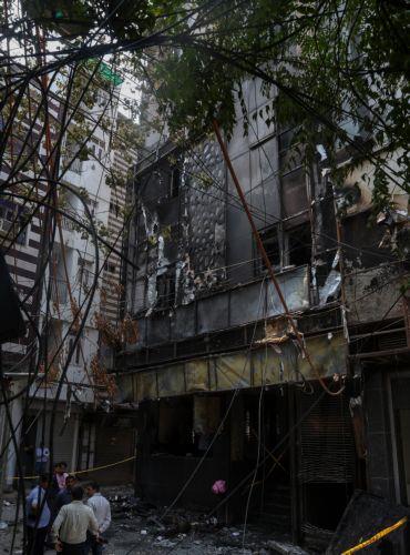 epa13012812 A general view of the site of fire in a hotel in New Delhi, India, 03 June 2026. According to authorities, at least 21 people have died and several others have been seriously injured following a fire in a hotel in the Malviya Nagar area of New Delhi.  EPA/RAJAT GUPTA