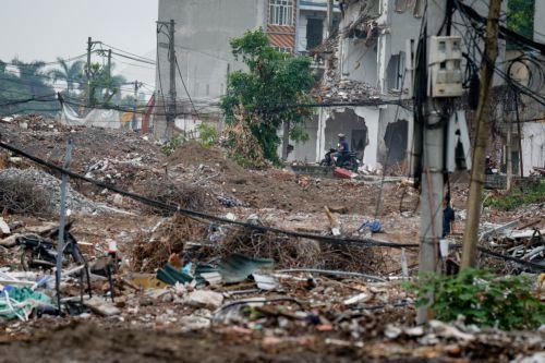 epa13017059 A man rides motorbike at a demolition site in Hanoi, Vietnam, 05 June 2026. World Environment Day is celebrated globally every year on 05 June and aims to bring awareness to environmental issues. The theme for 2026 is ‘Inspired by Nature. For Climate. For Our Future’.  EPA/LUONG THAI LINH