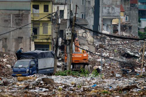 epa13017064 A woman collects garbage at a demolition site in Hanoi, Vietnam, 05 June 2026. World Environment Day is celebrated globally every year on 05 June and aims to bring awareness to environmental issues. The theme for 2026 is ‘Inspired by Nature. For Climate. For Our Future’.  EPA/LUONG THAI LINH