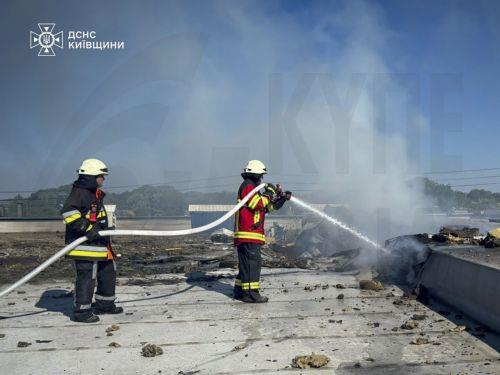 epa13017290 A handout photo made available by the State Emergency Service shows Ukrainian rescuers working at the site of a Russian strike on a food industry enterprise in Kyiv's area, Ukraine, 05 June 2026, amid the ongoing Russian invasion. At least four people were killed and four others were injured in an overnight Russian attack on the food industry...