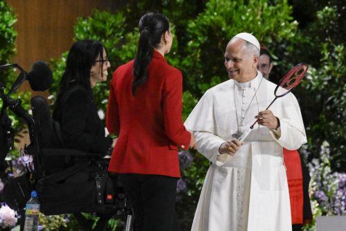 epa13022988 Pope Leo XIV (R) receives a badminton racket as a gift from former badminton player Carolina Marin (C) during the 'Building networks with the world of Culture, Art, Economy and Sports' at the Movistar Arena in Madrid, Spain, 07 June 2026. Pope Leo XIV is undertaking an official six-day visit to Spain from 06 to 12 June 2026, covering Madrid, ...