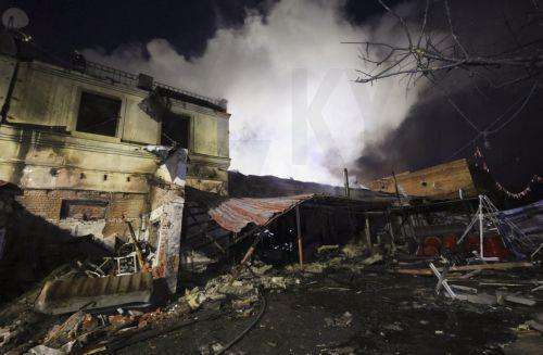 epa13025591 Ukrainian rescuers work at the site of a Russian strike on a residential area in Kharkiv, Ukraine, 09 June 2026, amid the ongoing Russian invasion. At least three people were killed and 18 injured, including two children, as Russia attacked Kharkiv and the region, according to the State Emergency Service.  EPA/SERGEY KOZLOV