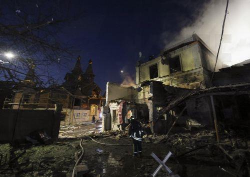 epa13025593 Ukrainian rescuers work at the site of a Russian strike on a residential area in Kharkiv, Ukraine, 09 June 2026, amid the ongoing Russian invasion. At least three people were killed and 18 injured, including two children, as Russia attacked Kharkiv and the region, according to the State Emergency Service.  EPA/SERGEY KOZLOV