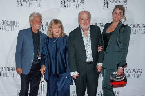 epa13031654 English-Australian songwriter Terry Britten (L) and Scottish songwriter Graham Lyle (2-R) pose with family members ahead of the Songwriters Hall of Fame 2026 induction ceremony in New York, New York, USA, 11 June 2026. Britten and Lyle are 2026 Songwriters Hall of Fame inductees.  EPA/OLGA FEDOROVA