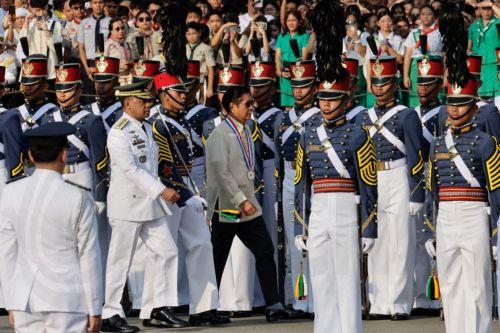 epa13031701 Philippine President Ferdinand Marcos Jr. (C), walks past military cadet honor troops during ceremonies marking the 128th Philippine Independence Day anniversary at the Jose Rizal Monument of Luneta Park in Manila, Philippines, 12 June 2026. The Philippines declared independence on 12 June 1898 after more than 300 years of Spanish colonial rule....