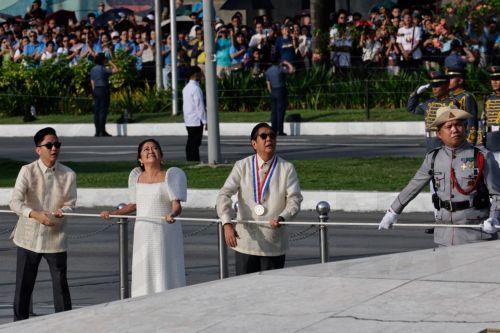 epa13031707 Philippine President Ferdinand Marcos Jr. (3-L), with First Lady Liza Araneta-Marcos (2-L) and their son, Congressman Sandro Marcos (L), lead the flag raising ceremony marking the 128th Philippine Independence Day anniversary at the Jose Rizal Monument of Luneta Park in Manila, Philippines, 12 June 2026. The Philippines declared independence on...