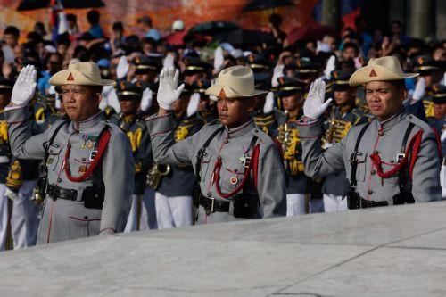 epa13031710 Members of the Philippine Army Security and Escort Battalion take a patriotic oath during ceremonies marking the 128th Philippine Independence Day anniversary at the Jose Rizal Monument of Luneta Park in Manila, Philippines, 12 June 2026. The Philippines declared independence on 12 June 1898 after more than 300 years of Spanish colonial rule. ...