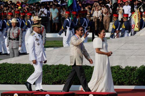 epa13031712 Philippine President Ferdinand Marcos Jr. (C) waves and walks with First Lady Liza Araneta-Marcos (R) during ceremonies marking the 128th Philippine Independence Day anniversary at the Jose Rizal Monument of Luneta Park in Manila, Philippines, 12 June 2026. The Philippines declared independence on 12 June 1898 after more than 300 years of...