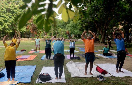 epa13040438 People attend a mass yoga session ahead of the 12th International Yoga Day in Kolkata, India, 16 June 2026. The 'International Day of Yoga' is celebrated annually on 21 June and has been recognized worldwide since 2015. The United Nations declared yoga a practice of physical, mental, and spiritual exercise originating in ancient India. This...
