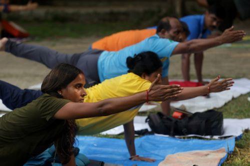 epa13040439 People attend a mass yoga session ahead of the 12th International Yoga Day in Kolkata, India, 16 June 2026. The 'International Day of Yoga' is celebrated annually on 21 June and has been recognized worldwide since 2015. The United Nations declared yoga a practice of physical, mental, and spiritual exercise originating in ancient India. This...