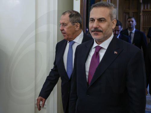 epa13040809 Russian Foreign Minister Sergey Lavrov (L) and Turkish Foreign Minister Hakan Fidan enter a hall during their meeting in Moscow, Russia, 16 June 2026.  EPA/SERGEI ILNITSKY