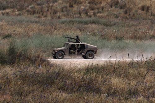 epa13044295 A military vehicles moves within southern Lebanon, as seen from the Israeli side of the border in the Upper Galilee, northern Israel, 17 June 2026. An Israeli army spokesperson reported that a soldier was severely injured, two soldiers were moderately injured, and two additional soldiers were lightly injured as a result of an explosive drone...