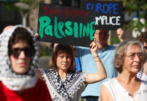 epa13044604 Swedish climate activist Greta Thunberg (C) joins Freedom Flotilla activists and supporters during a demonstration in support of Gaza near the European Council headquarters in Brussels, Belgium, 17 June 2026. The protest took place a day ahead of a meeting of European Union leaders in Brussels and follows the interception by Israeli forces of...
