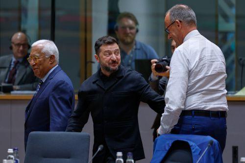 epa13047680 Ukraine's President Volodymyr Zelensky (C) talks to Germany's Chancellor Friedrich Merz (R) during a round table meeting at the European Council summit in Brussels, Belgium, 18 June 2026.  EPA/GEERT VANDEN WIJNGAERT / POOL