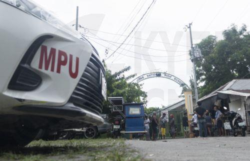 epa13056471 People wait outside the gates of the San Jose National High School in Tacloban City, Leyte province, Philippines, 22 June 2026. According to the Tacloban City Police Office (TCPO), three students were killed and more than five others were injured and taken to medical facilities for treatment. TCPO said the two suspects have been taken into...