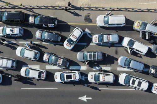 epa13061134 Ultra-Orthodox Jews driving in a convoy of cars to disrupt traffic as part of a national protest against the army recruitment in Jerusalem, 24 June 2026. Ultra-Orthodox protesters in various locations of the country disrupted traffic, calling for a protest against the conscription of ultra-Orthodox Jews into the IDF.  EPA/ABIR SULTAN EPA