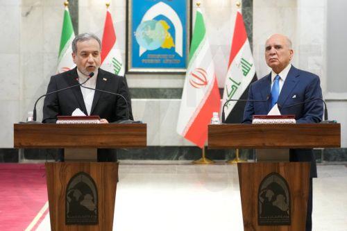 epa13070552 Iranian Foreign Minister Abbas Araghchi (L) and Iraqi Foreign Minister Fuad Hussein hold a joint press conference following their meeting at the Ministry of Foreign Affairs in Baghdad, Iraq, 28 June 2026.  EPA/CEERWAN AZEEZ