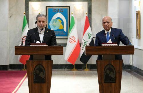 epa13070555 Iranian Foreign Minister Abbas Araghchi (L) and Iraqi Foreign Minister Fuad Hussein hold a joint press conference following their meeting at the Ministry of Foreign Affairs in Baghdad, Iraq, 28 June 2026.  EPA/CEERWAN AZEEZ