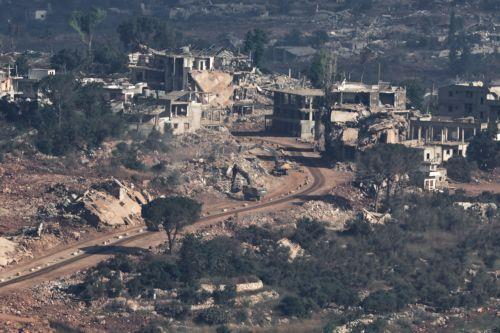 epa13070681 Israeli excavators demolish houses in the southern Lebanese village of Taybeh, as seen from the Israeli side of the border in the Upper Galilee, northern Israel, 28 June 2026, amid an Israel-Lebanon ceasefire.  EPA/ATEF SAFADI