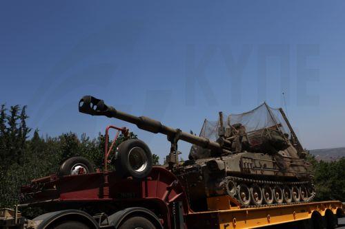 epa13070715 An Israeli truck carrying a mobile artillery unit is seen on a road in the Upper Galilee, northern Israel, 28 June 2026, amid an Israel-Lebanon ceasefire.  EPA/ATEF SAFADI