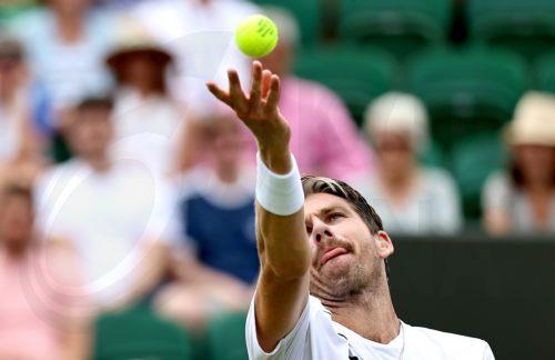 epa13072336 Cameron Norrie of Great Britain serves in his Men's Singles first round match against Michael Zheng of the USA at the Wimbledon Championships in London, Britain, 29 June 2026.  EPA/NEIL HALL