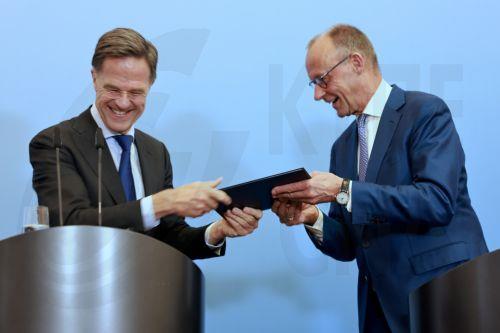 epa13077393 NATO Secretary General Mark Rutte (L) and German Chancellor Friedrich Merz attend a press conference following a weekly cabinet meeting of the German government at the Defence Ministry in Berlin, Germany, 01 July 2026. Rutte travelled to Berlin to attend the meeting of the Federal Cabinet.  EPA/HANNIBAL HANSCHKE