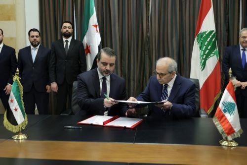 epa13079826 Lebanese Prime Minister Nawaf Salam (R) and Syrian Foreign Minister Asaad Al Shaibani (L) exchange a document on the formation of a joint Syrian‚ÄëLebanese committee following their meeting at the Government Palace in Beirut, Lebanon, 02 July 2026. Shaibani is on an official visit to Beirut to meet Lebanon's leaders.  EPA/WAEL HAMZEH