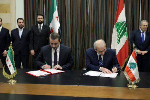 epa13079833 Lebanese Prime Minister Nawaf Salam (R) and Syrian Minister of Foreign Affairs Asaad Al Shaibani (L) sign a document on the formation of a joint Syrian-Lebanese committee following their meeting at the Government Palace in Beirut, Lebanon, 02 July 2026. Shaibani is on an official visit to Beirut to meet Lebanon's leaders.  EPA/WAEL HAMZEH