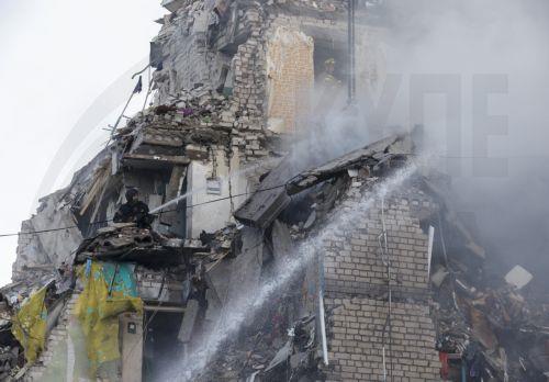 epaselect epa13079618 Ukrainian rescuers work at the site of a Russian missile strike on a nine-storey residential building in Kyiv, Ukraine, 02 July 2026, amid the Russian invasion. According to the State Emergency Service of Ukraine, at least 17 people were killed and more than 90 injured after a massive overnight Russian attack on Kyiv. The Ukrainian Air...
