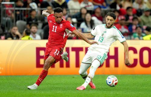 epa13082273 Jaouen Hadjam (R) of Algeria and Dan Ndoye of Switzerland in action during the FIFA World Cup 2026 Round of 32 match Switzerland against Algeria, in Vancouver, Canada, 02 July 2026.  EPA/BOB FRID