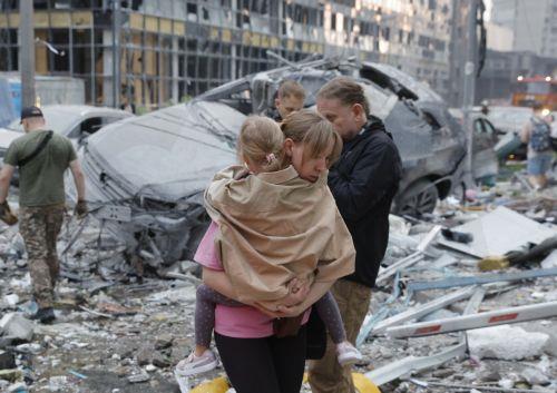 epa13090530 Local people react at the site of Russian strike on a residential building during a large-scale combined attack on a residential area in Kyiv, Ukraine, 06 July 2026, amid the Russian invasion. At least 10 people were killed and more than 43 injured after the overnight attack on Kyiv, according to the State Emergency Service. Russia launched 351...