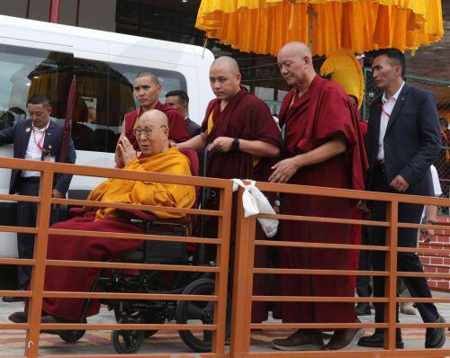 epa13090561 His Holiness the 14th Dalai Lama, Tenzin Gyatso (2-L), blesses Buddhist devotees as he departs after celebrating his 91st birthday during a public ceremony at the Jivetsal Teaching Ground in Choglamsar, near Leh, Ladakh, India, 06 July 2026. The birthday celebrations, jointly organised by the Ladakh Buddhist Association, the All Ladakh Gonpa...