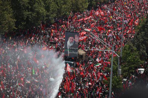 epa13090593 Iranians hold a portrait of the late Iranian Supreme Leader, Ayatollah Ali Khamenei, as they take part in his funeral ceremony in Tehran, Iran, 06 July 2026. Iran is holding a multi-day state funeral from 04 to 09 July 2026 for the leader, who was killed in a joint U.S. and Israeli airstrike on 28 February 2026.  EPA/ABEDIN TAHERKENAREH...