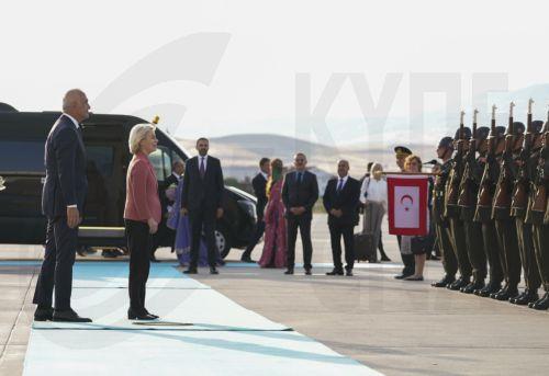 epa13092323 European Commission President Ursula von der Leyen (2L) is welcomed by Turkish Minister of Culture and Tourism, Mehmet Nuri Ersoy (L), at Esenboga Airport ahead of the 36th NATO Heads of State and Government Summit in Ankara, Turkiye, 06 July 2026. The summit will take place on 07–08 July, focusing on strengthening defense industrial production...